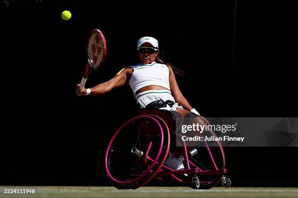 Angelica Bernal of Colombia plays a backhand against Yui Kamiji of Japan during the Ladies' Wheelchair Singles First Round match on day nine of The...