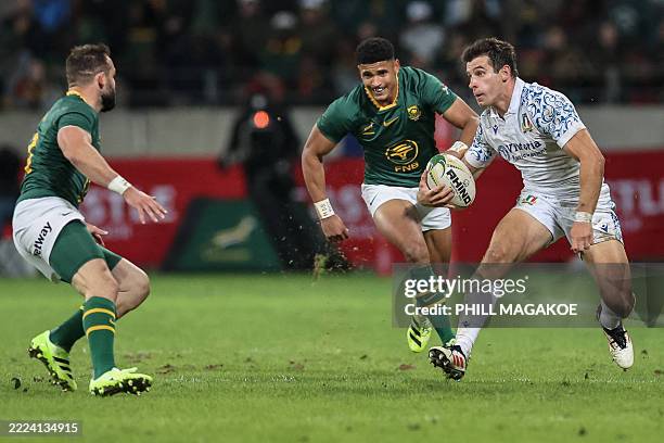 Italy's fullback Giulio Bertaccini runs with the ball during the international rugby union Test match between South Africa and Italy at Nelson...