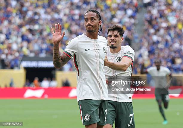 Joao Pedro celebrates scoring his team's first goal with teammate Pedro Neto of Chelsea FC during the FIFA Club World Cup 2025 semi-final match...