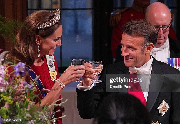 France's President Emmanuel Macron clinks glasses with Catherine, Princess of Wales during the State Banquet for President of France Emmanuel Macron...
