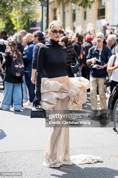 Leonie Hanne wears black cropped turtleneck, beige ruffled sequined skirt outside Stéphane Rolland during the Haute Couture Fall/Winter 2025/2026 as...