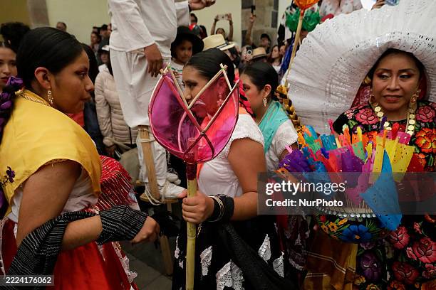 Women participate in the Guelaguetza cultural festival on the streets of downtown Tlalpan in Mexico City, Mexico, on July 12, 2025.