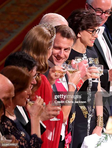 President Emmanuel Macron winks at Princess Catherine of Wales during a toast at the State Banquet at Windsor Castle on July 08, 2025 in Windsor,...