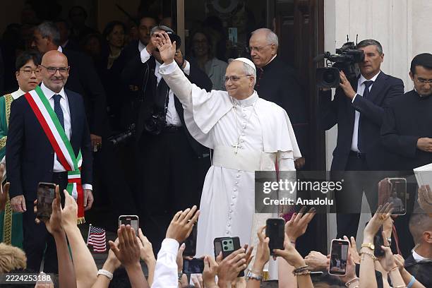 Pope Leo XIV greets the faithful as he arrives to celebrate a Mass at the church of St. Thomas of Villanova in Castel Gandolfo, Italy, on July 13,...