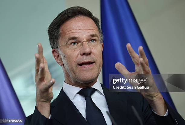 Secretary General Mark Rutte and German Chancellor Friedrich Merz speak to the media during talks at the Chancellery on July 09, 2025 in Berlin,...