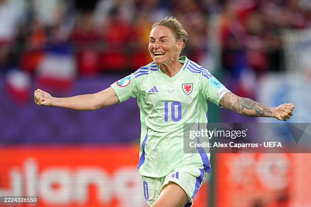 Jess Fishlock of Wales celebrates scoring her team's first goal after the VAR reviewed the on-field decision to disallow the goal before overturning...