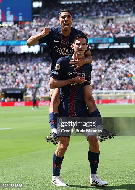 Fabian Ruiz of Paris Saint-Germain celebrates scoring his team's third goal with teammate Achraf Hakimi during the FIFA Club World Cup 2025...