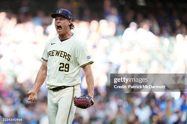 Trevor Megill of the Milwaukee Brewers celebrates after striking out Tommy Edman of the Los Angeles Dodgers in the top of the 10th inning at American...