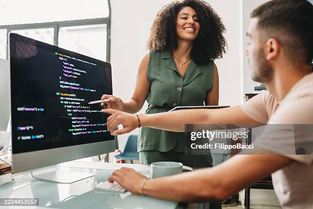 computer programmers working together on a software project - web design stock pictures, royalty-free photos & images