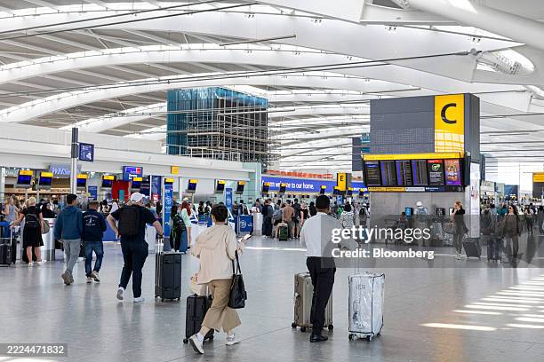 Passengers at the departures hall of Terminal 5 at London Heathrow Airport in London, UK, on Monday, July 14, 2025. London Heathrow Airport plans to...