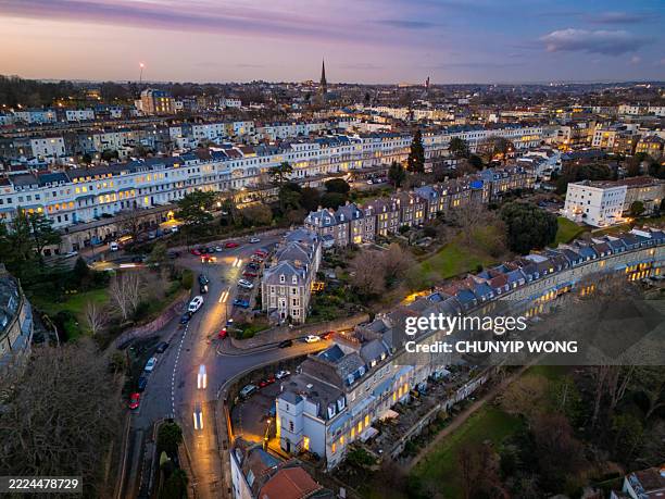 aerial view of the cliftonwood crescent and the clifton suspension bridge glowing at sunset, in bristol, england - bristol clifton stock pictures, royalty-free photos & images