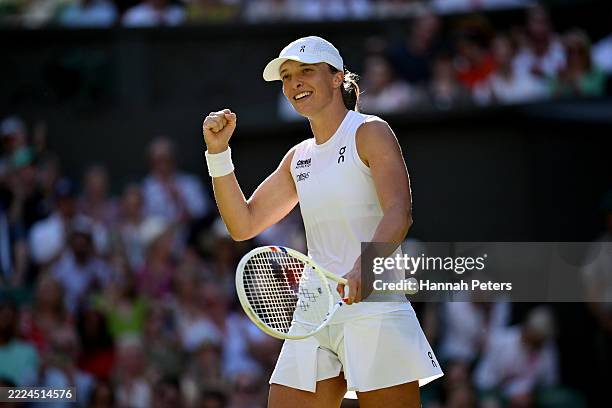 Iga Swiatek of Poland celebrates winning match point against Belinda Bencic of Switzerland during the Ladies' Singles semi-final match on day eleven...