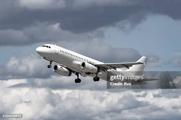 white passenger aircraft in the sky - jet plane fast stock pictures, royalty-free photos & images