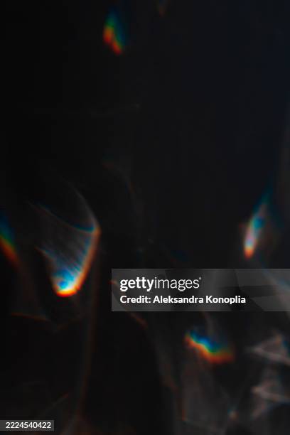 dark abstract pattern with iridescent light reflections on black - distress flare stock pictures, royalty-free photos & images