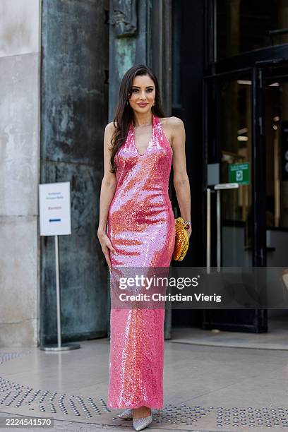 Guest wears pink sequined dress outside Rami Al Ali during the Haute Couture Fall/Winter 2025/2026 as part of Paris Fashion Week on July 10, 2025 in...