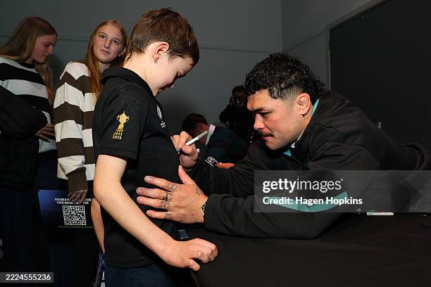 Du’Plessis Kirifi of the All Blacks signs autographs during a New Zealand All Blacks & Black Ferns joint media opportunity at Wellington Central on...