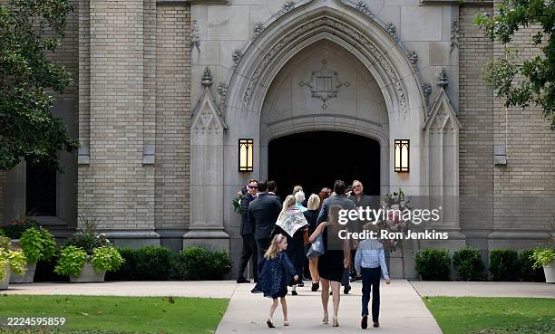 Mourners attend a memorial service for Camp Mystic camper Janie Hunt at Highland Park Presbyterian Church on July 15, 2025 in Dallas, Texas. Hunt a...