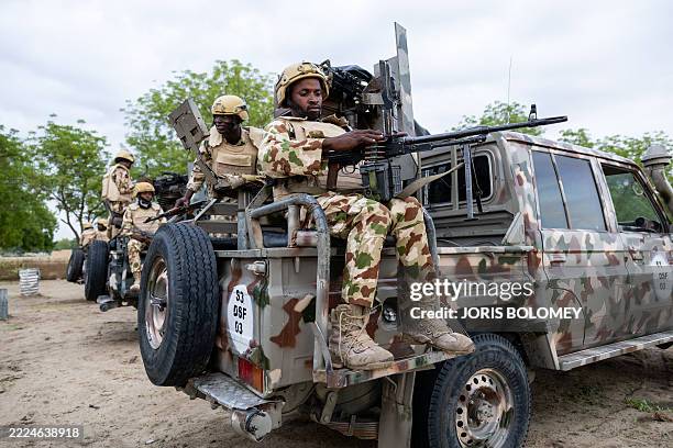 Nigerian soldier from the Multinational Joint Task Force loads his machine gun during training at the MNJTF military base, Sector 3 Headquarters, in...