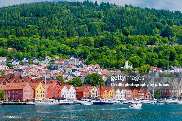 bryggen is a medieval wharf on the harbor in bergen, norway - june 14, 2025 - bergen foto e immagini stock