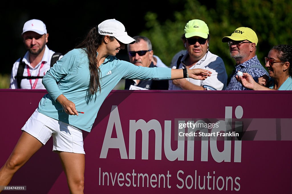 Julia Lopez Ramirez of Spain signs a golf ball for a fan on first tee