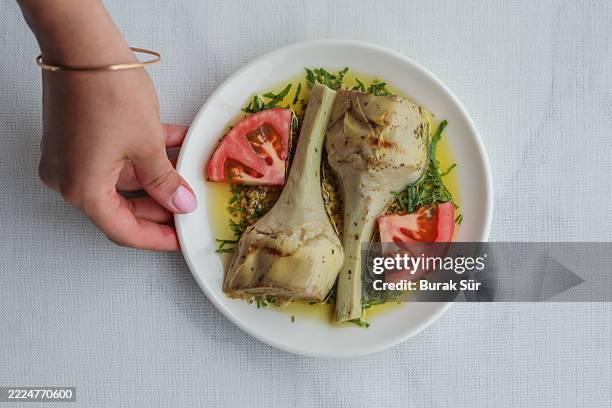 ready-to-eat artichokes with olive oil, - zinc stock pictures, royalty-free photos & images