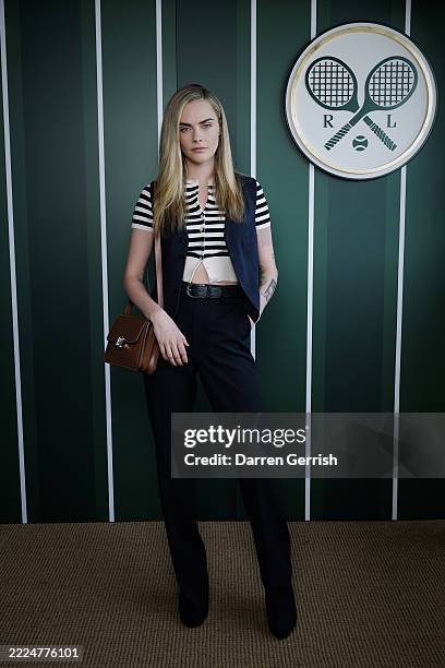 Cara Delevingne, wearing Ralph Lauren, attends the Ralph Lauren Suite during The Championships, Wimbledon at All England Lawn Tennis and Croquet Club...