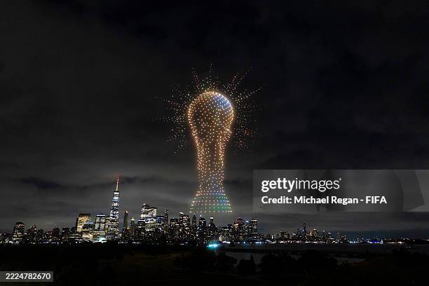 An image of the FIFA World Cup trophy is displayed against the Manhatten skyline by 1500 drones in a FIFA drone show ahead of the Club World Cup...