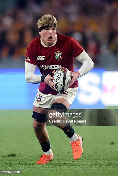 Henry Pollock of the British & Irish Lions runs with the ball during the tour match between AUNZ XV and British & Irish Lions at the Adelaide Oval on...