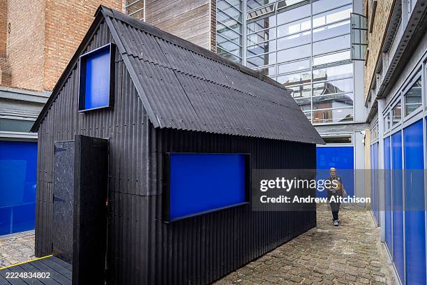 The house showing Sara Wood's new film installation overlays archival footage taken by Jarman, as part of his preparations for 'The Garden' part of...