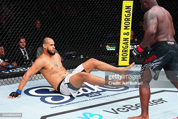 Derrick Lewis drops Tallison Teixeira of Brazil with a punch in a heavyweight fight during the UFC Fight Night event at Bridgestone Arena on July 12,...