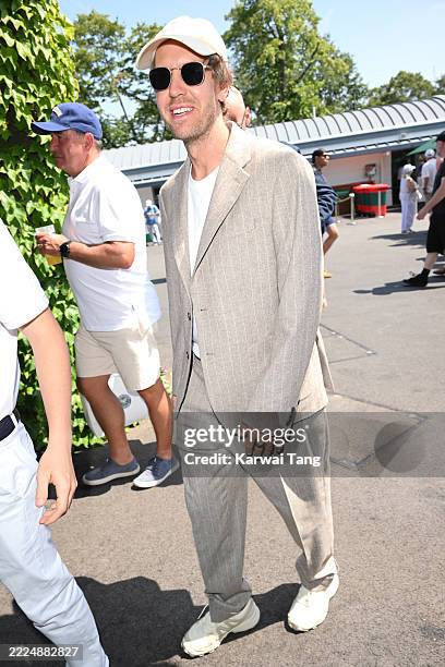 Sebastian Vettel attends day fourteen of the Wimbledon Tennis Championships at the All England Lawn Tennis and Croquet Club at All England Lawn...