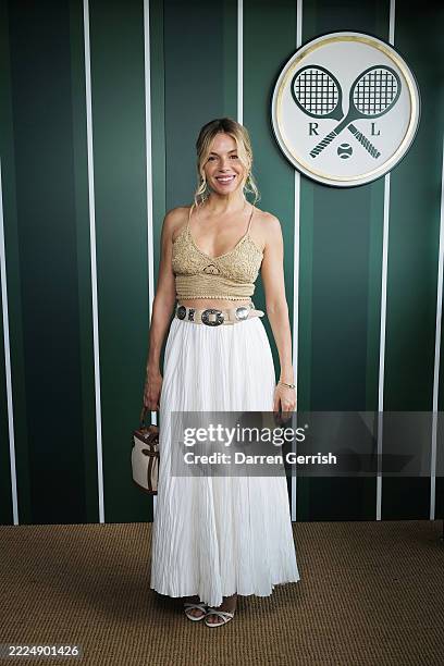 Sienna Miller, wearing Ralph Lauren, attends the Ralph Lauren Suite during The Championships, Wimbledon at All England Lawn Tennis and Croquet Club...