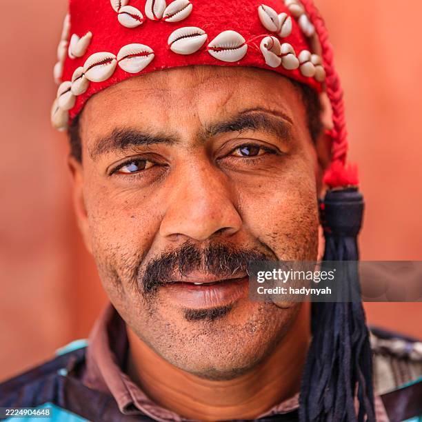 portrait of street musician in marrakesh, morocco - moroccan culture stock pictures, royalty-free photos & images