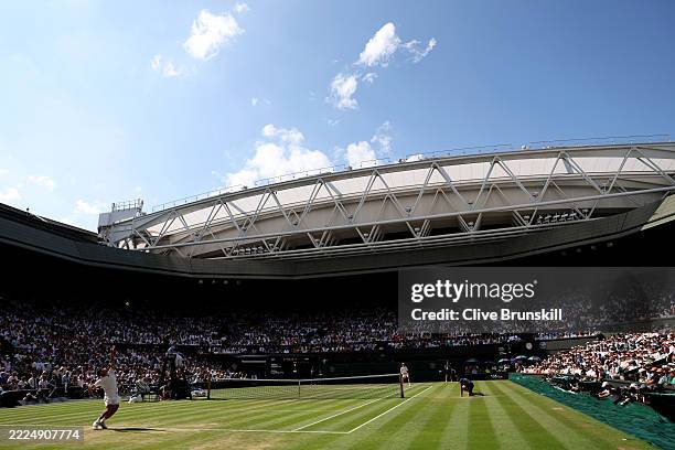 General view over Centre Court as Carlos Alcaraz of Spain serves against Jannik Sinner of Italy during the Gentleman's Singles Final on day fourteen...