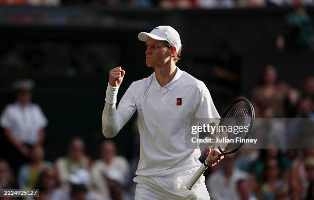 Jannik Sinner of Italy celebrates winning the third set against Carlos Alcaraz of Spain during the Gentleman's Singles Final on day fourteen of The...