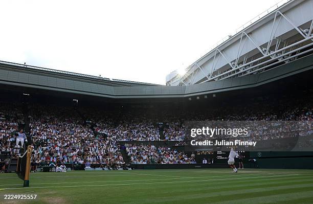 General view over Centre Court as Carlos Alcaraz of Spain serves against Jannik Sinner of Italy during the Gentleman's Singles Final on day fourteen...