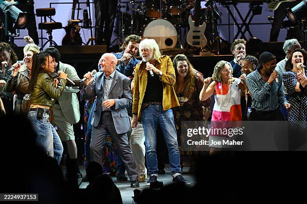 Fayth Ifil, Midge Ure, Bob Geldof, Craige Els, Claire Bertschinger and cast members perform on stage during the curtain call at the "Live Aid" 40th...