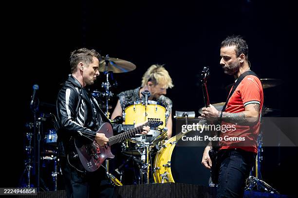 Matt Bellamy, Dominic Howard and Chris Wolstenholme from Muse perform on the NOS stage during day 3 of NOS Alive Festival at Passeio Marítimo de...