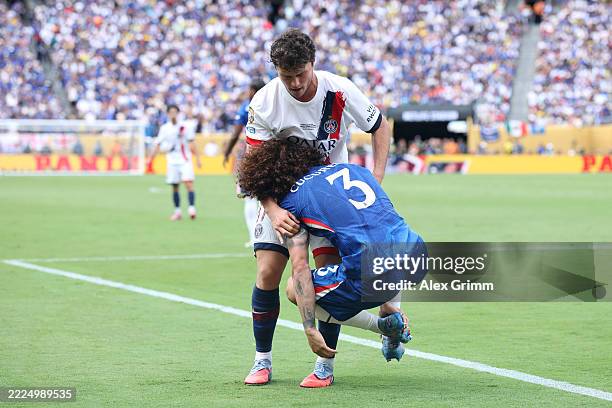 Joao Neves of Paris Saint-Germain lifts up Marc Cucurella of Chelsea FC during the FIFA Club World Cup 2025 final match between Chelsea FC and Paris...