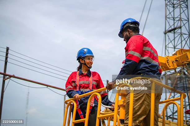 engineers are working at construction site. - mobile crane stock pictures, royalty-free photos & images