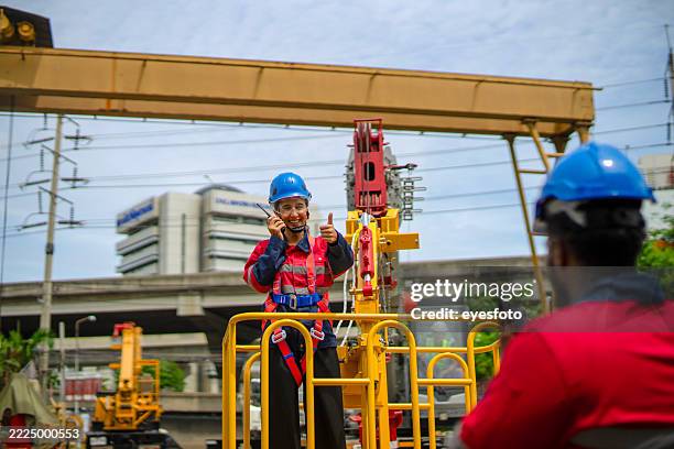 engineers are working at construction site. - mobile crane stock pictures, royalty-free photos & images