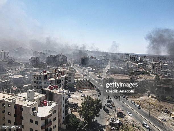 Smoke rises as clashes continue between Bedouin Arabs and some Druze armed groups in Suwayda, Syria on July 19, 2025. Intense fighting take place in...