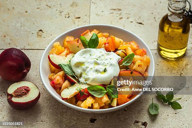 peach and tomato salad with burrata mozzarella cheese, olive oil and fresh basil - nectarine stock pictures, royalty-free photos & images
