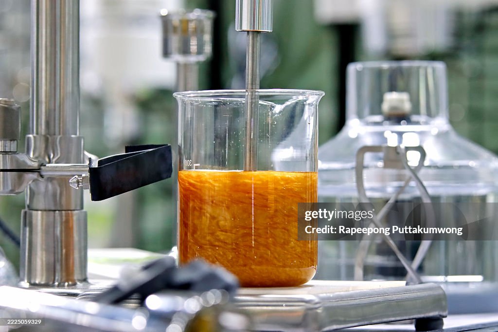 Chemical Mixture Undergoing Agitation by a Mechanical Stirrer.