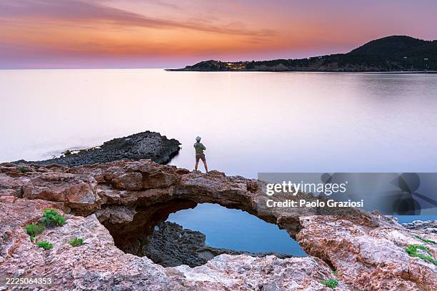 man on a cliff watching sunrise, spain - off the beaten path stock pictures, royalty-free photos & images