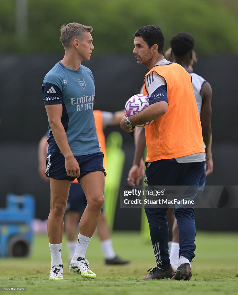 Arsenal Training Arsenal manager Mikel Arteta talks to Leandro Trossard during a... News ...