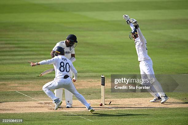 India batsman Mohammed Siraj looks back to see the ball hit his stumps as Ollie Pope and Jamie Smith celebrate during day five of the third test...