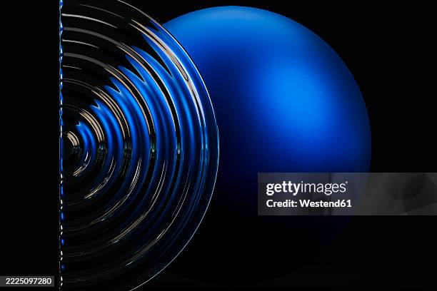 abstract composition with a blue sphere and fluted glass on a dark background - ripple effect stock illustrations