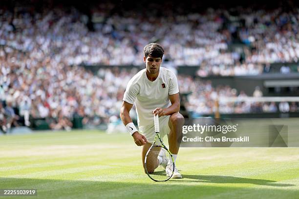Carlos Alcaraz of Spain after falling over against Jannik Sinner of Italy during the Gentleman's Singles Final on day fourteen of The Championships...