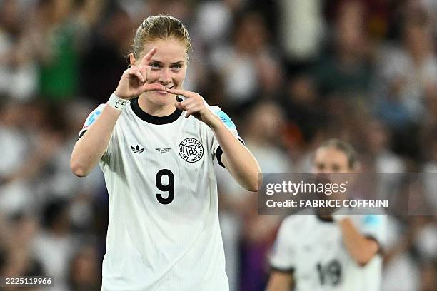 Germany's midfielder Sjoeke Nuesken gestures as she celebrates after scoring her team's first goal during the UEFA Women's Euro 2025 quarter finals...